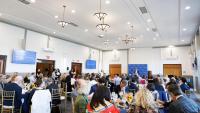 Bard Hall lounge with decorated tables and chairs and a grand piano